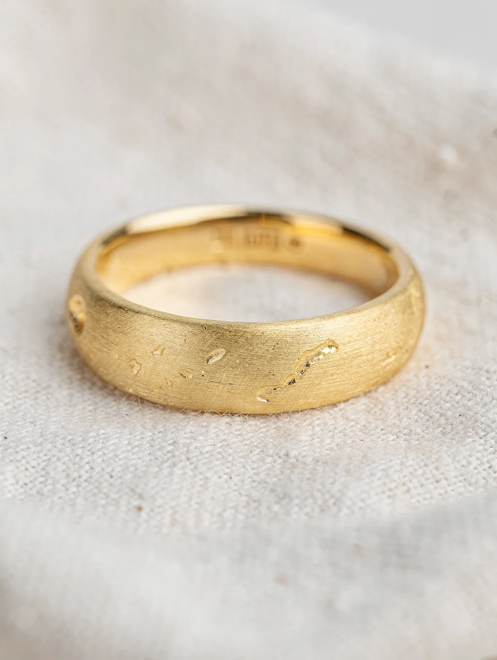 Handcrafted 18k gold ring with brushed texture